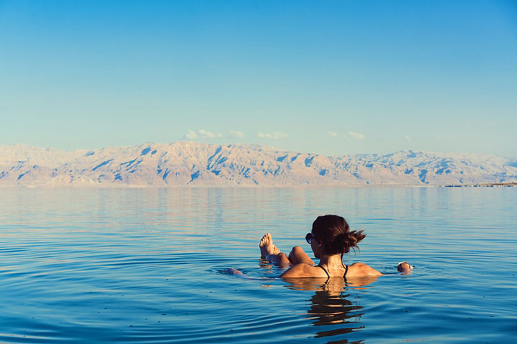 Visitors can check out the stillness of the Dead Sea &copy; Hrecheniuk Oleksii/Shutterstock