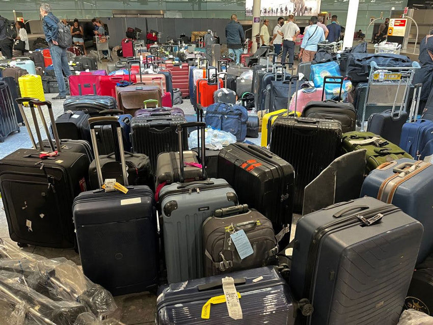 Piles of uncollected luggage in London's Heathrow airport during a system glitch in June &copy; Getty Images